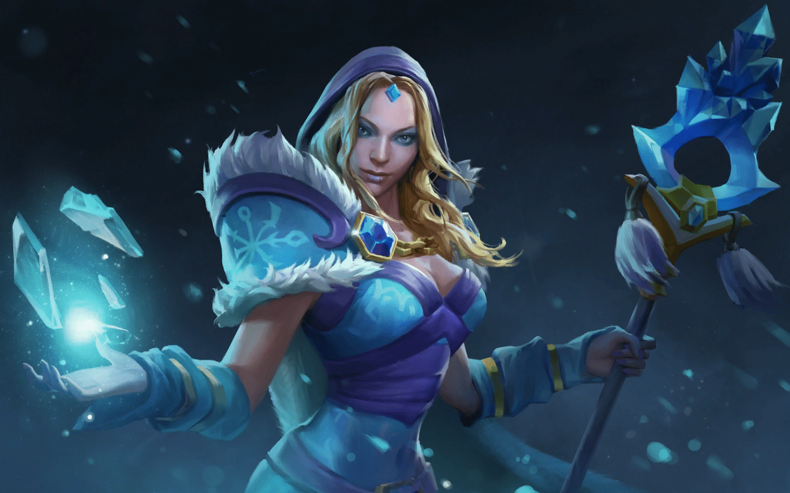Dota 2 Hero Crystal Maiden stojí vo svojom modro-bielom kožušinovom rúchu a v jednej ruke zviera palicu, v dlani druhej privoláva tri trblietavé modré cencúle.
