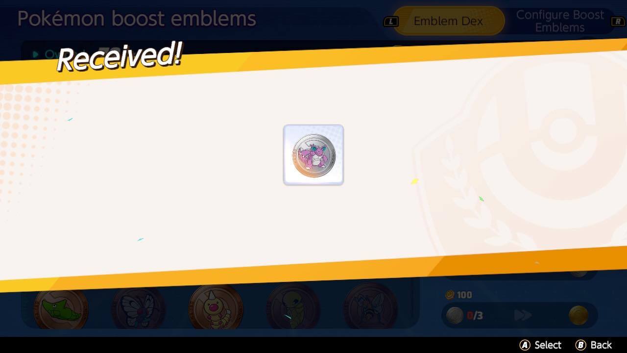 Et sølv Nidoking Boost-emblem modtaget fra sammenlægning