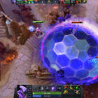 A purple character with a hammer-head shape casts a large blue and purple dome spell that stuns other players and monsters