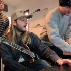Malevolence band members in the studio tracking a song for World of Warcraft: Midnight, with instruments and recording equipment visible