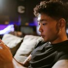 guy playing game in mobile