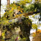 A screenshot of a Call of Duty: Modern Warfare 4 soldier holding a rifle in a ghillie suit.